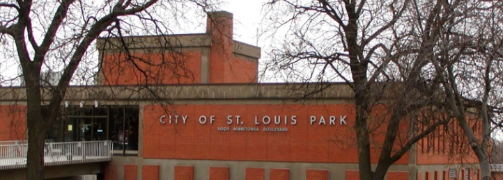 City of St. Louis Park municipal building with brick exterior and leafless trees in winter.