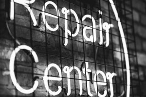 black-and-white-photo-of-neon-repair-center-sign