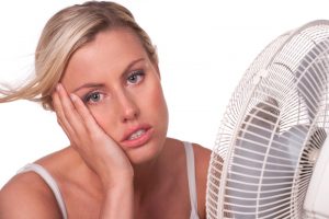 woman-cooling-off-in-front-of-fan