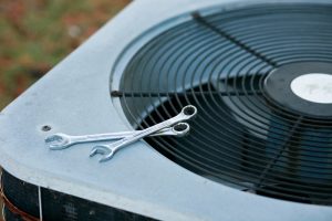 air-conditioner-with-wrench-placed-on-top