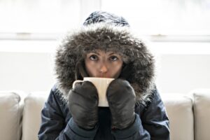 woman-in-parka-sipping-from-mug