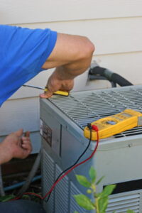 air-conditioner-unit-being-repaired